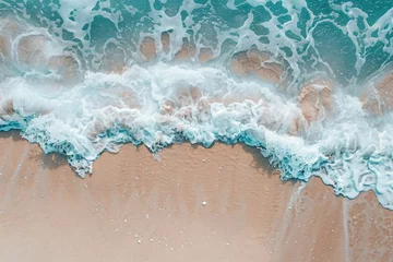 Fotobehang The waves crashing onto the shore © Le