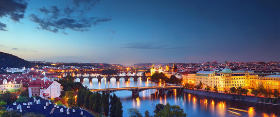 Fototapeta premium Aerial View Of Bridges Over Vltava River From Letna Park. Prague, Czech Republic by night