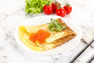 Russian pancake with red caviar