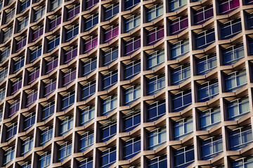 1960s modernism: post-war skyscraper; architectural symmetry, brutalist design, Centre Point skyscraper facade at Tottenham Court Road, Oxford Street, London UK, an iconic brutalist skyscraper
