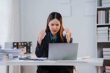 The Pressure is On: A young businesswoman in a stylish suit, a look of frustration etched on her...