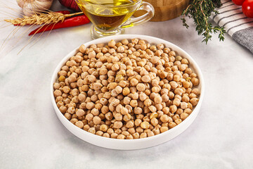 Dry chickpea seeds heap in the bowl