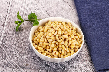 Peeled cedar nut in the bowl