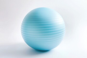 Fototapeta premium A light blue yoga ball, lying flat against a white background