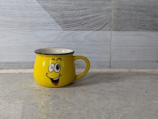 yellow smile cup isolated on white background