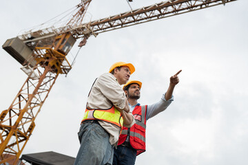 Asia engineer man worker and India engineer man working with crane background	