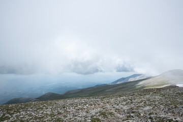 Mountain landscapes covered with white clouds. Cloudy mountains. Blue sky and magnificent white clouds. Magnificent Uludağ treking routes. Cloudy views from Uludağ.