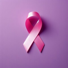pink awareness ribbon isolated on purple background