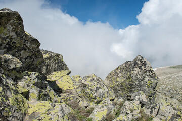 Mountain landscapes covered with white clouds. Cloudy mountains. Blue sky and magnificent white clouds. Magnificent Uludağ treking routes. Cloudy views from Uludağ.