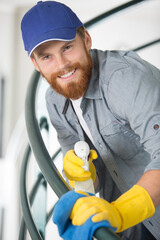 young man cleaning the staircase