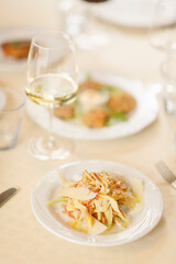Close up on italian traditional northern food on a restaurant table. Many dishes are visible.