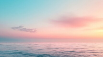 Naklejka premium A beautiful blue ocean with a pink sky in the background. The sky is filled with clouds, giving the scene a serene and peaceful atmosphere