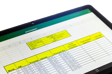 Shot of an excel sheet on tablet screen showing bank loan amortization table on the transparent...