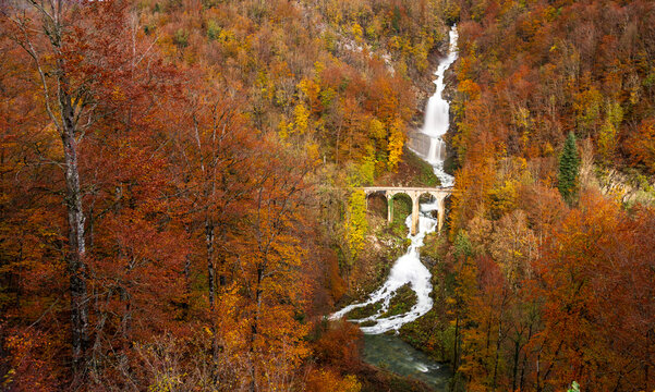 Vibrant autumn colors at Cascade du Bief de la Ruine