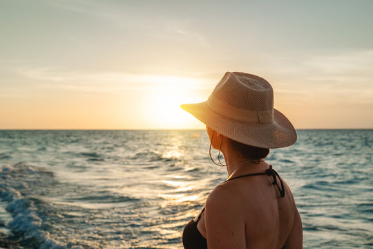Woman enjoying sunset at Varadero Beach in Cuba