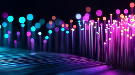 Close up of glowing fiber optic cables against dark background