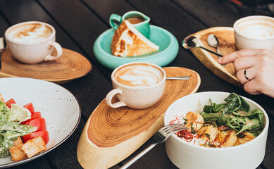 Anonymous person having a hearty breakfast at a cafe
