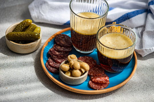 Kvass and traditional snacks, sausages, mushrooms, and pickles