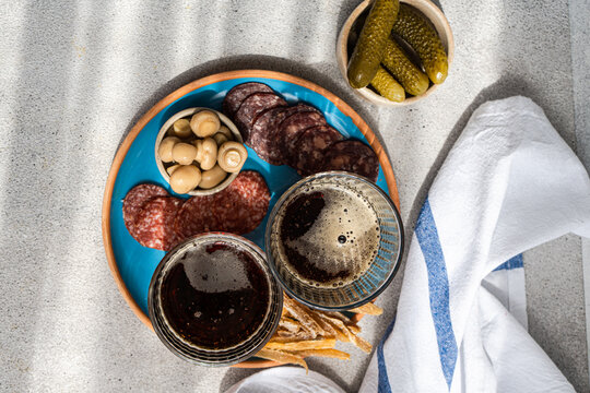 Traditional kvass and snacks on a sunny tabletop