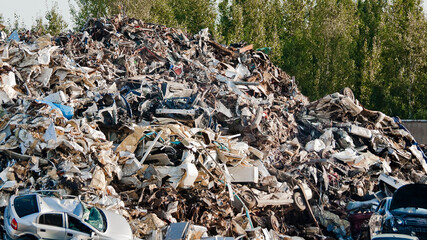 a mountain of metal waste at a metal recycling and collection point