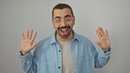 Fototapeta premium Young hispanic man with glasses and moustache isolated on white background smiling and holding hands up.