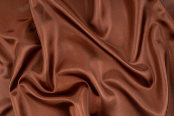 Texture of natural cocoa fabric or cloth in same color. Fabric texture of natural cotton, silk or wool, or linen textile material