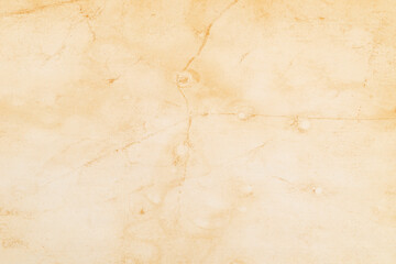 Old vintage paper with a glowing center and grunge.