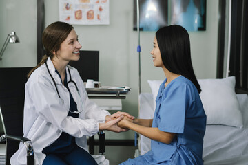 Fototapeta premium Doctor's hand reassuring patient and recommending treatment methods at the clinic.