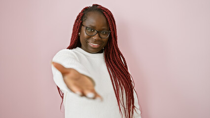 Portrait of a smiling african american woman with braids, wearing glasses and white sweater,...