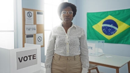 Woman standing in an electoral college room with a brazil flag in the background, voting booth, and...