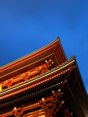 Japanese red Senso-ji temple under a blue sky
