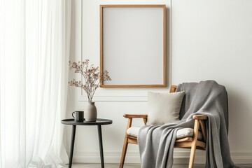 A minimalist reading nook featuring a wooden armchair with a gray blanket draped over