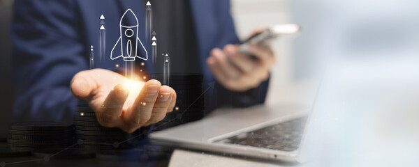 entrepreneur businessman hand with rocket sign and type strategy of new project and planning to join startup project for building company for business development with creative and innovative concept