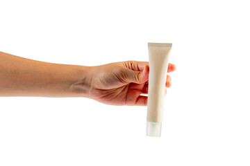 Plastic white tube for cream or lotion. Skin care or sunscreen cosmetic with hand on transparent background.
