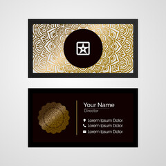 Luxury mandala business card template with gold color