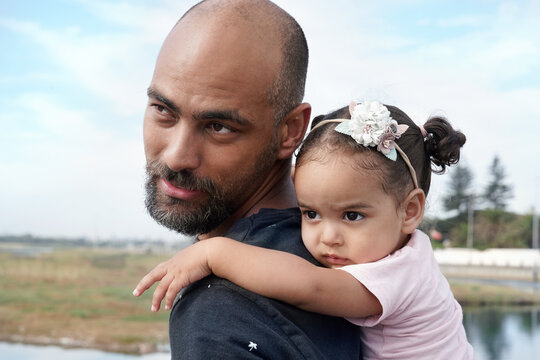 Father giving piggy back ride to daughter