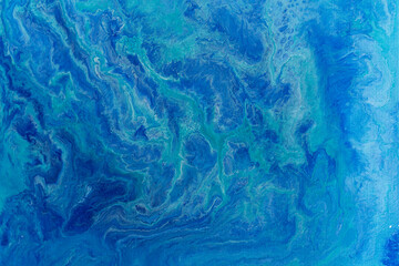 青色の絵具のマーブル模様の背景