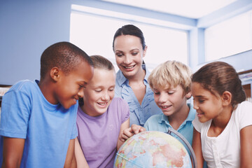 Fototapeta premium World map, teacher and students with help, education and conversation with knowledge, learning and advice. Geography, woman and friends in school, children or studying with development and answer