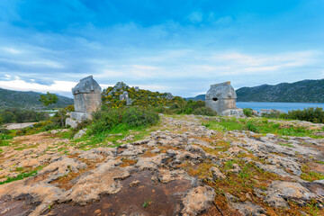 Simena  ancient city rock .tomb against drama sky