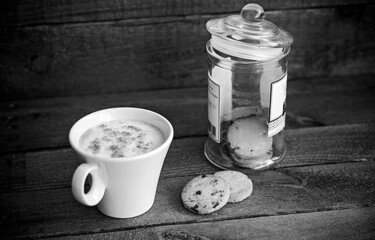 Delicious coffee and cookies, on a wooden background
