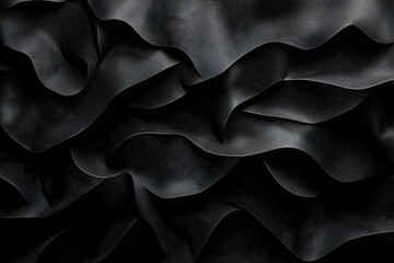 Obraz premium Rippling black fabric texture showcasing elegant folds and shadows