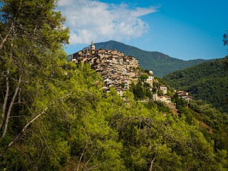 Italian Village Apricale with Stone Buildings, Flower Pots, and Rustic Signs.