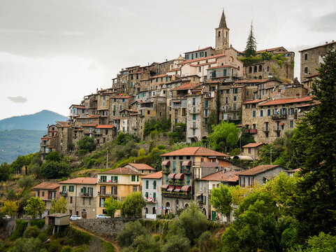 Italian Village Apricale with Stone Buildings, Flower Pots, and Rustic Signs.
