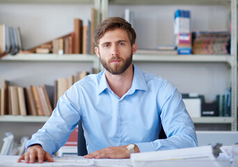 Office, portrait and man at desk with blueprint, confidence and paperwork for design project management. Architect, businessman or professional with creative ideas, floor plan or business development