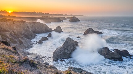A scenic sunset over the ocean with waves crashing against rocky cliffs.