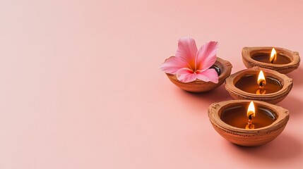 Burning Diwali diya oil lamps with flowers. Beautiful happy Diwali background. Indian festival of lights.