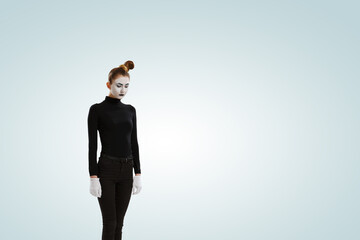 Female mime with white face