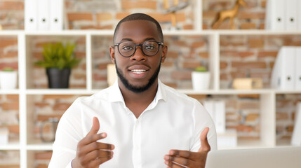 Obraz premium Confident Young Man in Glasses Gesturing While Working from Home Office