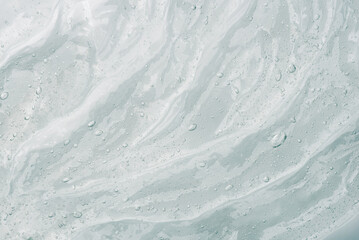 Transparent gel texture on a white background.