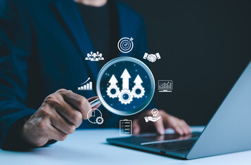 Increase productivity and Business growth concept. Magnifying glass focuses on arrows and gears, symbolizing productivity, growth, and business efficiency, with additional business icons surrounding,